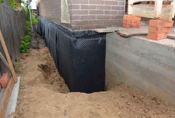 Happy homeowners after waterproofing job in Cedar Grove